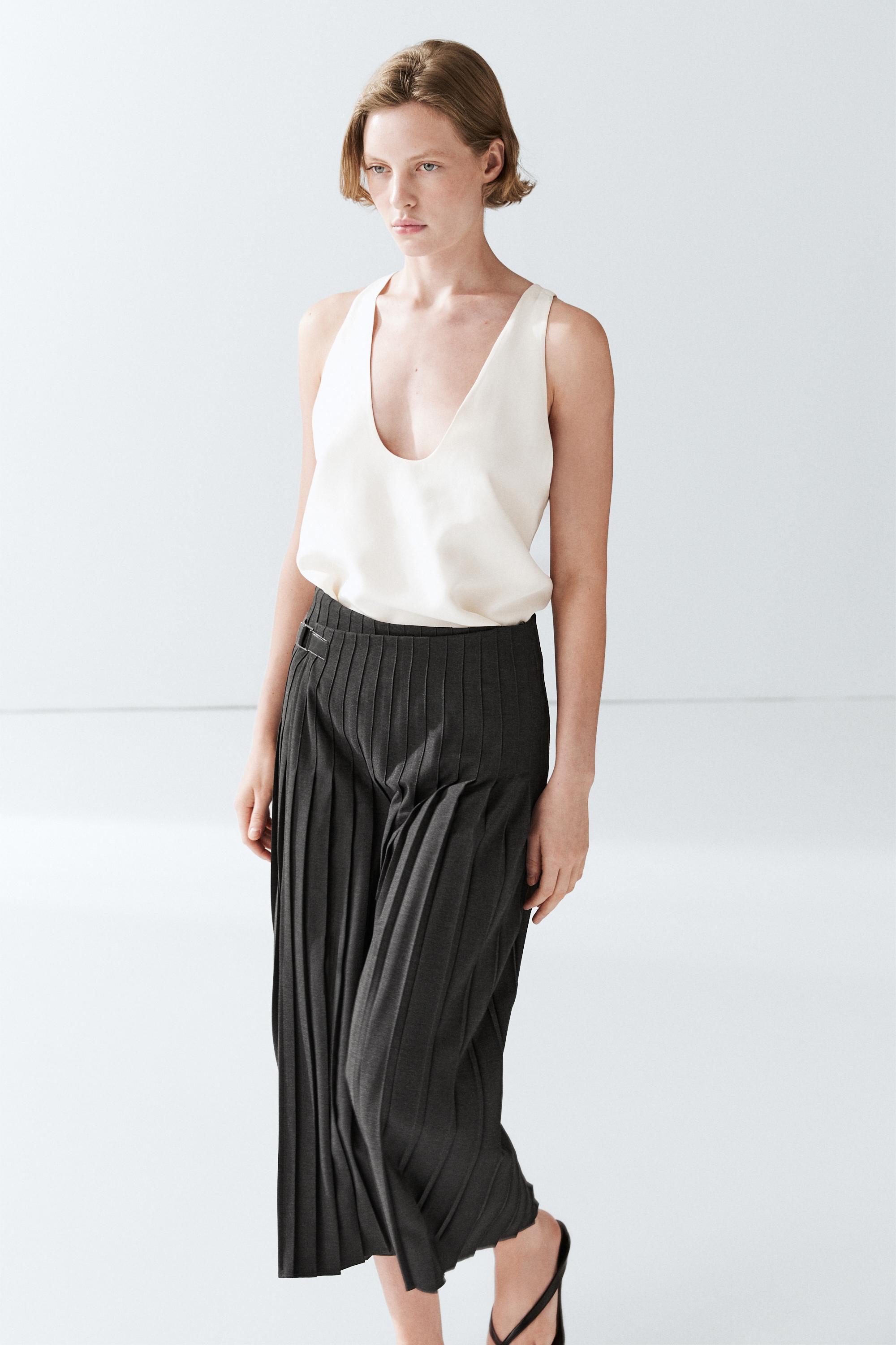 Jupe midi plissée applique